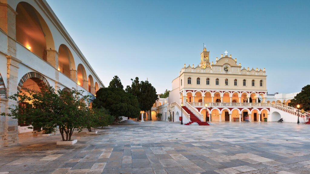 View across a plaza at sunset in Tinos